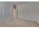 Bedroom with carpeted floors and neutral walls, featuring ample closet space and an open doorway at 827 Klamath Springs St, Henderson, NV 89011