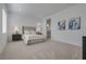 Spacious bedroom features plush carpeting, neutral tones, and natural light at 827 Klamath Springs St, Henderson, NV 89011
