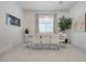 Bright dining room features a modern chandelier, seating for six, and neutral decor at 827 Klamath Springs St, Henderson, NV 89011