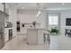 Open kitchen with stainless steel appliances, a breakfast bar, and ample counter space at 827 Klamath Springs St, Henderson, NV 89011