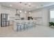 Modern kitchen with a large island, stainless steel appliances, and bar stool seating at 827 Klamath Springs St, Henderson, NV 89011
