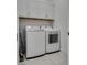 A laundry room with new front load washer and dryer at 827 Klamath Springs St, Henderson, NV 89011