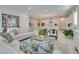 Open-concept living room with a view of the kitchen and stylish decor at 827 Klamath Springs St, Henderson, NV 89011