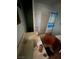 Interior view of a bathroom with a stained sink, a shower with a dated curtain, and debris at 895 Greasewood Ln, Moapa, NV 89025