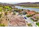 Stunning aerial view of the community overlooking a lake and a lush golf course at 9 Rue Grimaldi Way, Henderson, NV 89011