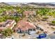 Expansive aerial view of the home with mature landscaping and scenic mountain backdrop at 9 Rue Grimaldi Way, Henderson, NV 89011