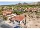 Stunning aerial shot of a luxury home, lush landscaping, and mountains in the distance at 9 Rue Grimaldi Way, Henderson, NV 89011