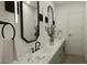 Modern bathroom featuring double sinks, marble countertops and modern lighting at 9 Rue Grimaldi Way, Henderson, NV 89011