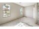 Spacious bedroom with large windows offering beautiful views of a lush, landscaped yard at 9 Rue Grimaldi Way, Henderson, NV 89011