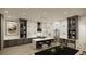 Spacious kitchen featuring marble countertops, stainless steel appliances, and pendant lighting at 9 Rue Grimaldi Way, Henderson, NV 89011