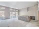 Unfinished kitchen with a center island and large sliding glass doors with backyard views at 9 Rue Grimaldi Way, Henderson, NV 89011