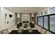 Contemporary living room with fireplace, floor-to-ceiling windows, and modern decor at 9 Rue Grimaldi Way, Henderson, NV 89011