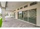 Covered patio with stone flooring and sliding glass doors showcasing indoor/outdoor living at 9 Rue Grimaldi Way, Henderson, NV 89011