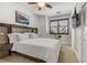 Bright, well-lit bedroom with a large bed, ceiling fan, and modern decor at 9050 W Tropicana Ave # 1102, Las Vegas, NV 89147