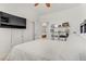 Comfortable bedroom with sleek design, featuring TV, and access to ensuite bath at 9050 W Tropicana Ave # 1102, Las Vegas, NV 89147