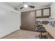 This functional bedroom includes a murphy bed, built-in cabinets, and a workspace to maximize the space at 9050 W Tropicana Ave # 1102, Las Vegas, NV 89147