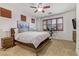 Bright bedroom with a spacious layout, window shutters, and modern ceiling fan at 9050 W Tropicana Ave # 1102, Las Vegas, NV 89147