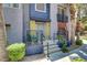 Inviting front porch with seating area and well-maintained landscaping at 9050 W Tropicana Ave # 1102, Las Vegas, NV 89147