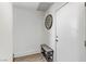 Inviting hallway features a bench, wall clock, and door, offering a practical and stylish entry into the home at 9050 W Tropicana Ave # 1102, Las Vegas, NV 89147