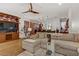 Expansive living room with a comfortable sectional sofa, sleek ceiling fan, and convenient open layout to the kitchen at 9050 W Tropicana Ave # 1102, Las Vegas, NV 89147
