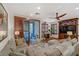 Spacious living room features a comfortable sectional sofa, modern ceiling fan, shutters, and sliding doors to a patio at 9050 W Tropicana Ave # 1102, Las Vegas, NV 89147