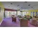 Community lounge area with comfortable seating, accent wall, and ample light at 9050 W Tropicana Ave # 1102, Las Vegas, NV 89147