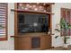 Living room built-in entertainment center and shelving unit in this stylish home at 9050 W Tropicana Ave # 1102, Las Vegas, NV 89147