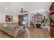 Comfortable living room with a large sectional sofa, modern ceiling fan, shutters, and access to a patio at 9050 W Tropicana Ave # 1102, Las Vegas, NV 89147