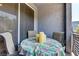 Balcony with outdoor seating, table, and chairs at 9050 W Tropicana Ave # 1102, Las Vegas, NV 89147