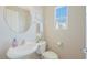 Bright powder room features modern fixtures, decor, and plenty of natural light at 9053 Pearl Cotton Ave, Las Vegas, NV 89149