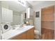 Bright primary bathroom features modern vanity, toilet, shower, and an attached walk-in closet at 9053 Pearl Cotton Ave, Las Vegas, NV 89149