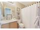 Bathroom with neutral walls, sink vanity, decorative sign, and a shower with a curtain at 9053 Pearl Cotton Ave, Las Vegas, NV 89149