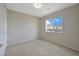 Neutral bedroom featuring a large window with neighborhood views and plush carpeting at 9053 Pearl Cotton Ave, Las Vegas, NV 89149