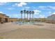 Community pool area with lounge chairs and palm trees, perfect for relaxation at 9053 Pearl Cotton Ave, Las Vegas, NV 89149