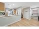 Bright kitchen featuring an open layout, light wood cabinets, and a breakfast bar with decorative accents at 9053 Pearl Cotton Ave, Las Vegas, NV 89149