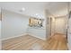 Bright living room features wood floors, neutral walls, and an open access to the kitchen at 9053 Pearl Cotton Ave, Las Vegas, NV 89149