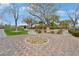 Community playground with grassy areas, mature trees, and paved walkways at 9053 Pearl Cotton Ave, Las Vegas, NV 89149