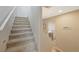 Carpeted staircase with neutral walls leading to the home's upper level at 9053 Pearl Cotton Ave, Las Vegas, NV 89149