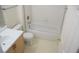 Bathroom with a vanity, toilet, and shower-tub combo at 9672 Gunsmith Dr, Las Vegas, NV 89123
