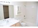 Bright bathroom with a vanity, storage, and tub/shower combo at 9672 Gunsmith Dr, Las Vegas, NV 89123