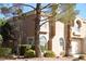 Charming two-story home with arched windows and mature landscaping at 9672 Gunsmith Dr, Las Vegas, NV 89123