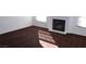 Cozy living room with neutral carpet and a fireplace at 9672 Gunsmith Dr, Las Vegas, NV 89123