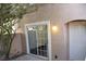 Private patio with sliding glass door and neutral exterior color at 9672 Gunsmith Dr, Las Vegas, NV 89123