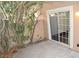 Private patio with sliding glass door access and neutral color scheme at 9672 Gunsmith Dr, Las Vegas, NV 89123