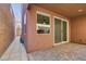 Covered patio with pavers. Windows and sliding glass doors visible at 10581 Griffin Ave, Las Vegas, NV 89129