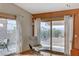 Bright sunroom with sliding glass doors leading to a view of the backyard and mountains in the distance at 1093 Morning Sun Way, Las Vegas, NV 89110