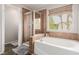 Bathroom featuring large tub and glass-enclosed shower at 11237 Gallery Echo St, Las Vegas, NV 89141
