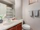 Bathroom with single sink, vanity, and bath with shower at 11237 Gallery Echo St, Las Vegas, NV 89141