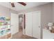 Bedroom with carpet, closet, decor and ample lighting, making it a cozy retreat at 11237 Gallery Echo St, Las Vegas, NV 89141