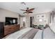 Bright bedroom featuring ceiling fan, closet and drawers at 11237 Gallery Echo St, Las Vegas, NV 89141